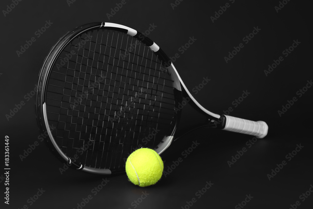 Tennis racket and ball on dark background Stock Photo | Adobe Stock