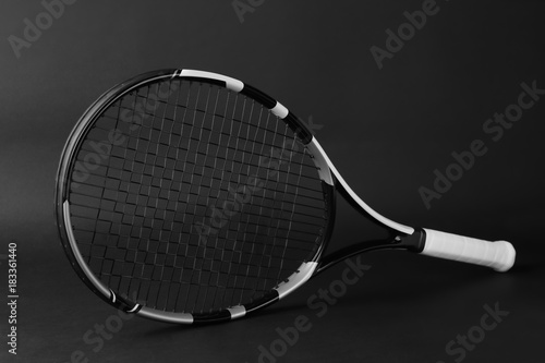 Tennis racket on dark background © Africa Studio