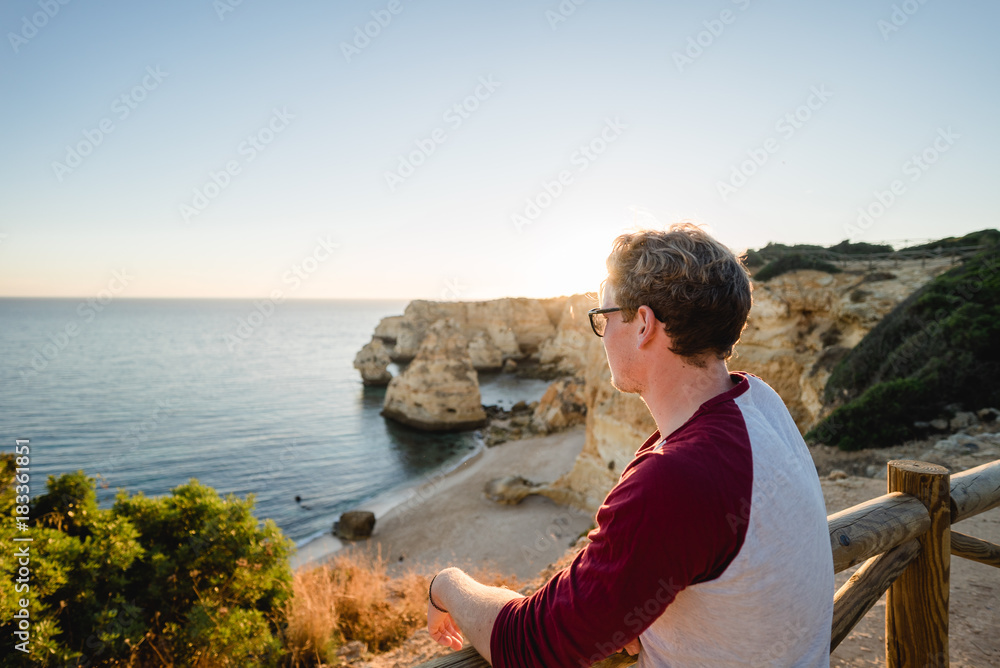 Man watching the sunset in Portugal