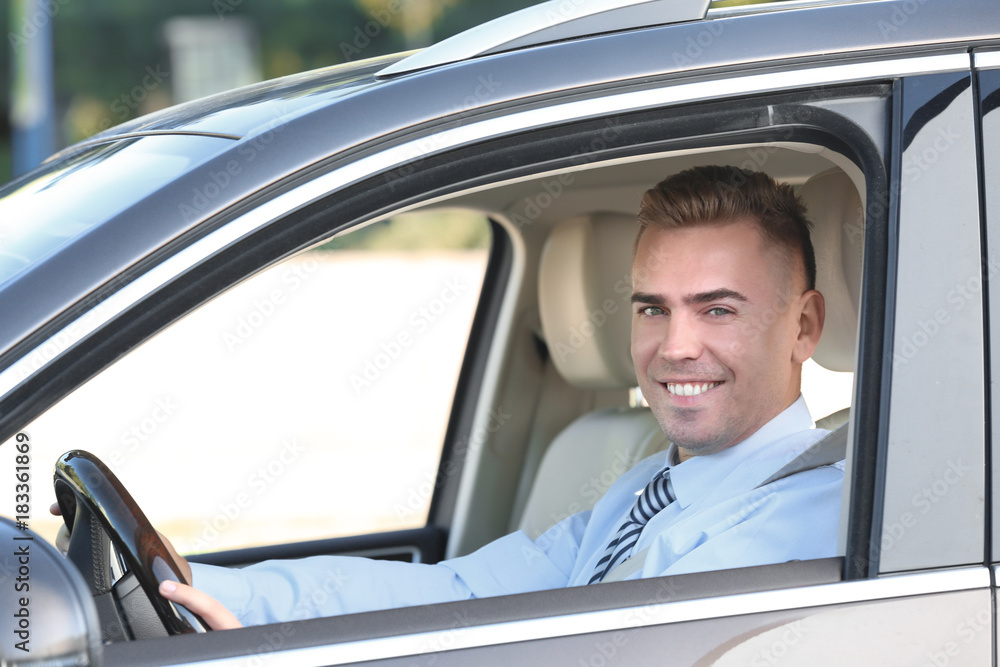 Man in formal wear on driver's seat of car Man in formal wear on driver's seat of car