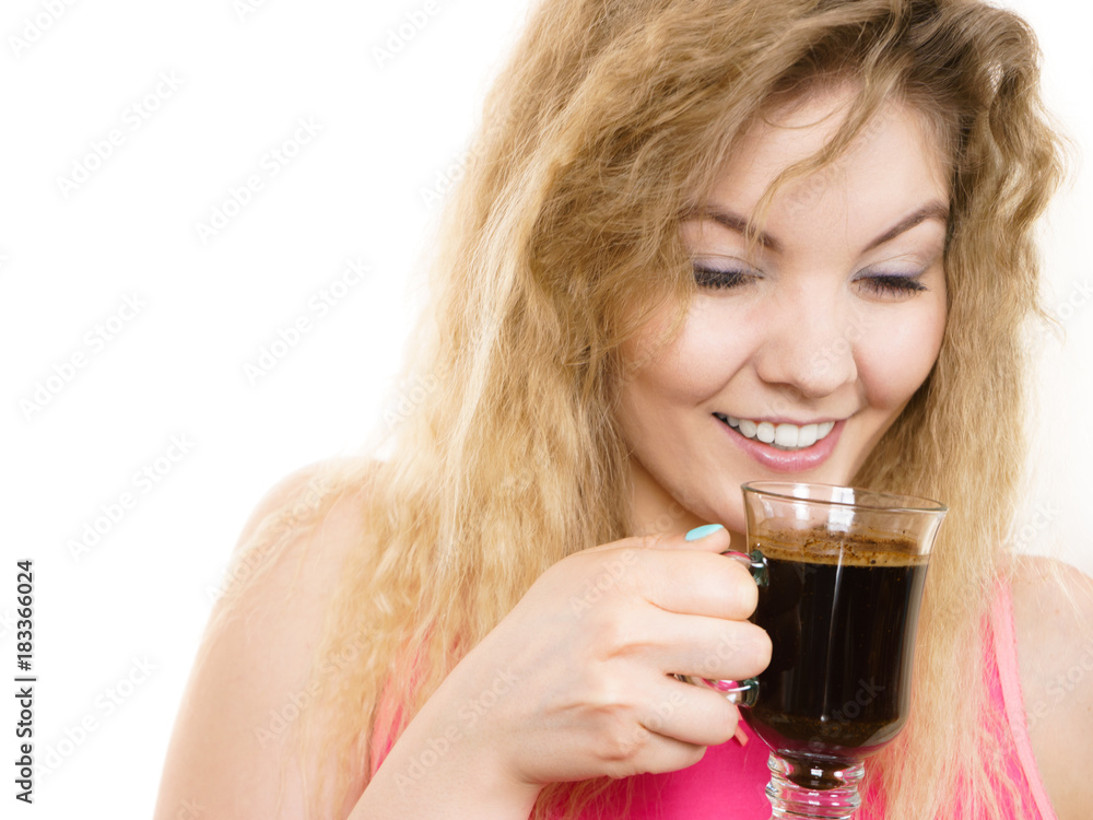 Positive woman drinking her morning coffee Positive woman drinking her morning coffee