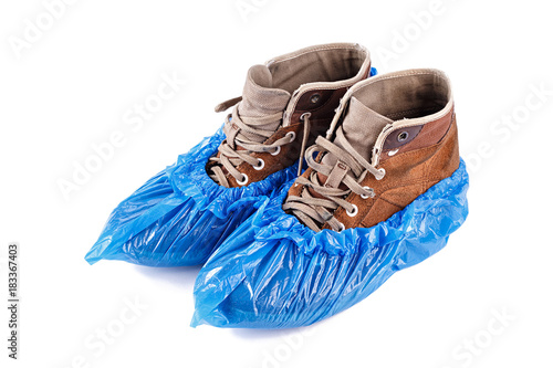 blue shoe covers on men's shoes photo