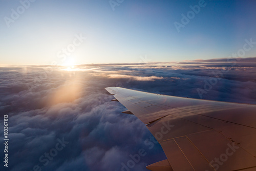 Watching the sunrise from an airplane