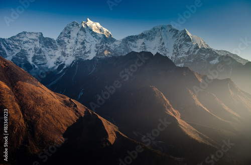 Himalayan mountain range,Mt. Kangtega and Mt.Thamserku at sunset photo