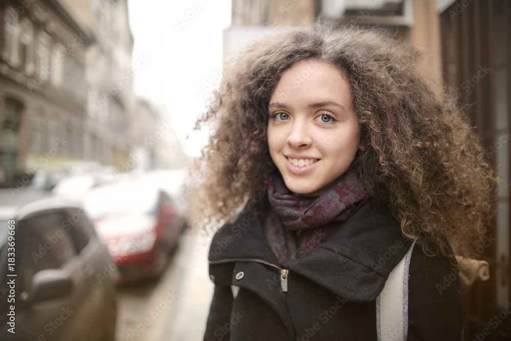 Smiling girl in the street Smiling girl in the street