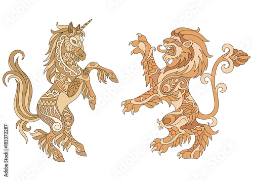 Heraldic unicorn and lion silhouettes in gold colors. Heraldry logo design elements. Luxury coat of arms concept.