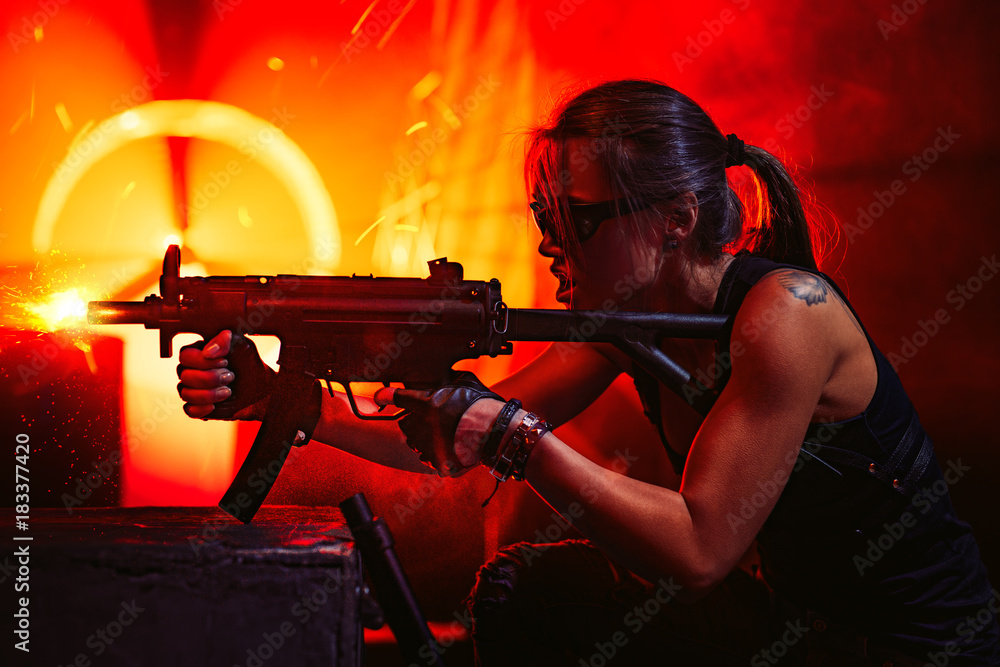 Woman warrior with gun Stock Photo | Adobe Stock