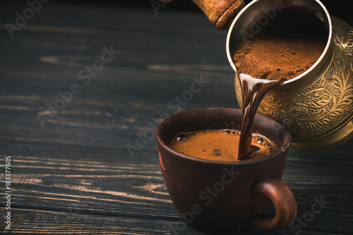 Pouring turkish coffee photo