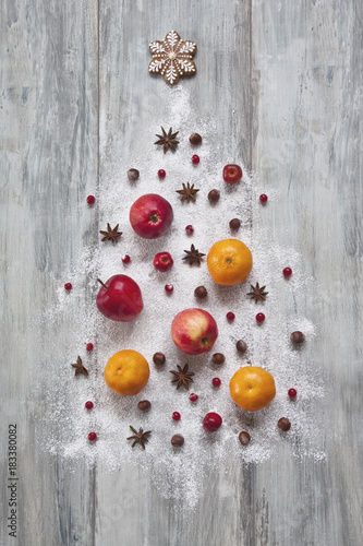 Sweet Christmas. A Christmas tree made of fruits, berries and spices. Close-up, top view, christmas background.