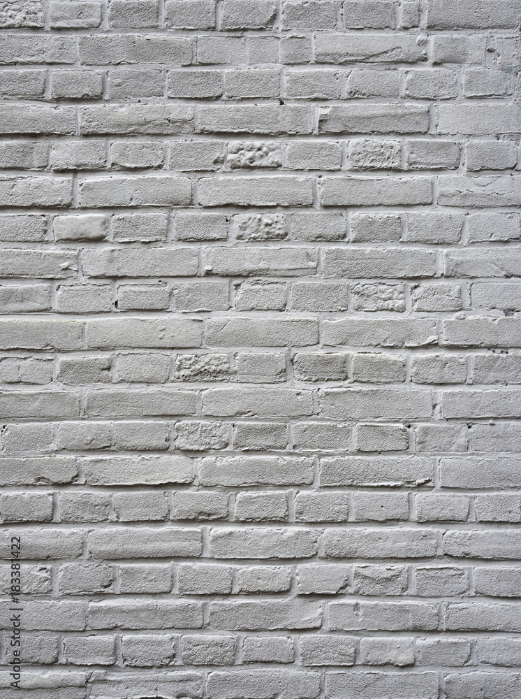 closeup of grey painted vertical part of brick wall closeup of grey painted vertical part of brick wall