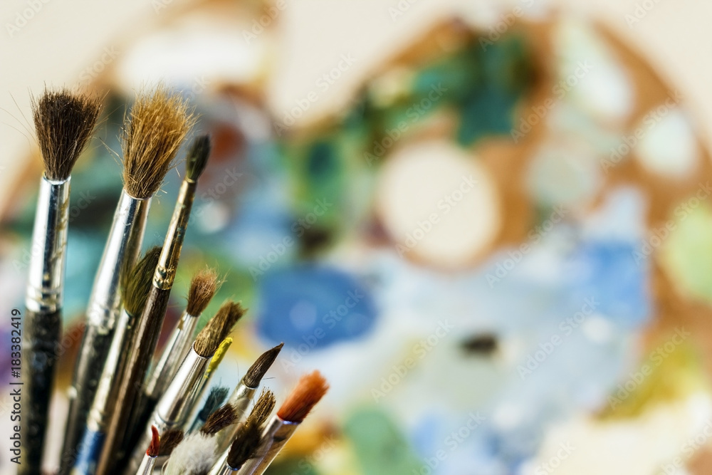 Fototapeta premium artist's palette with tassels close-up