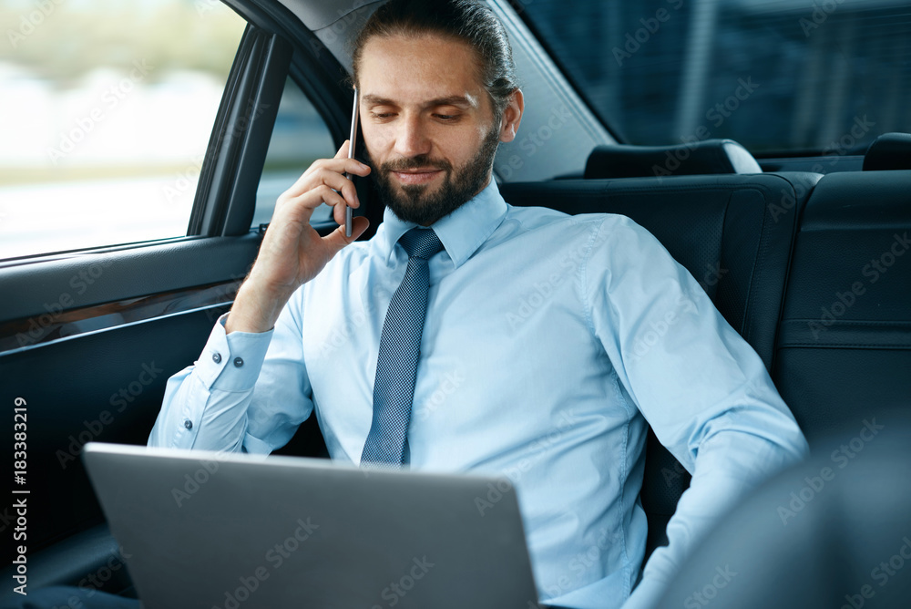 Business Man In Car Calling On Phone While Going To Work