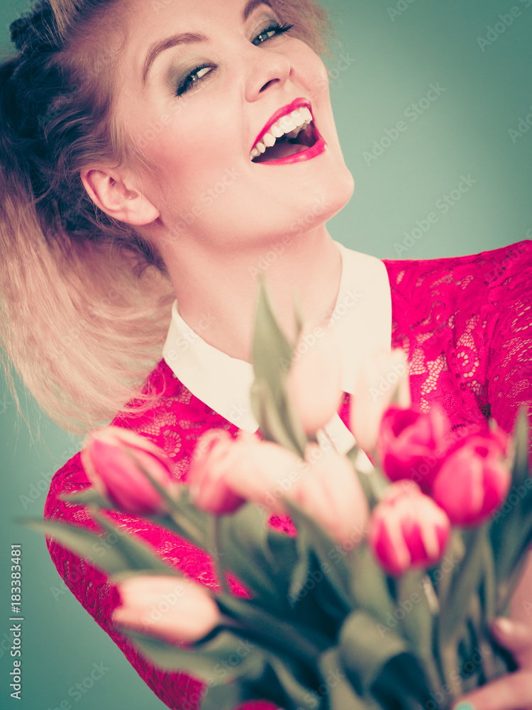 Fototapeta premium Woman holding bouquet of tulips flowers