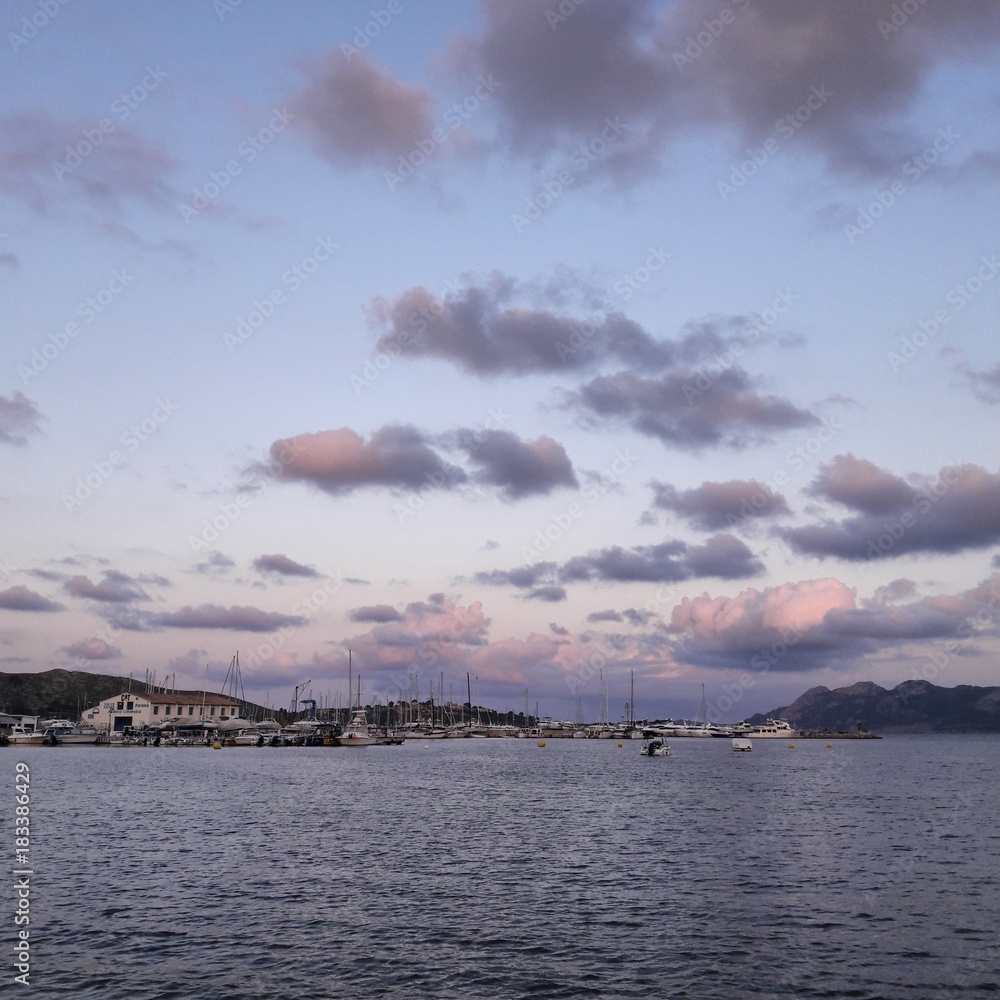 Sea view at sunset with port in the background