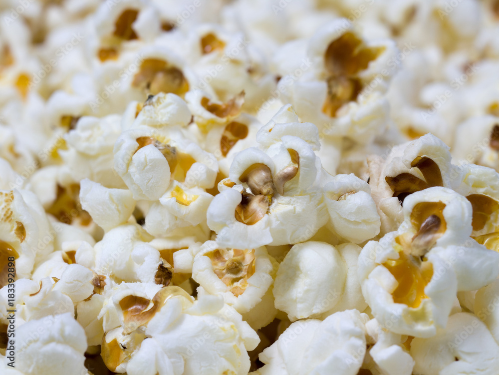 close - up pop corn grains. Cinema and television watching snacks close - up pop corn grains. Cinema and television watching snacks