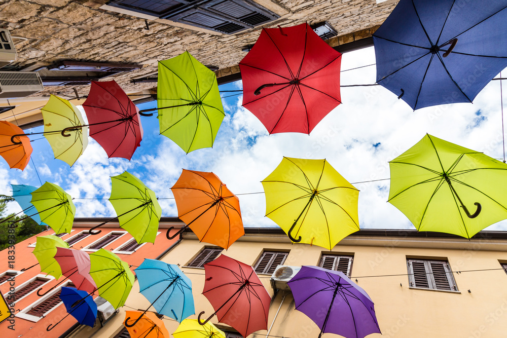 Bunte Regenschirme über einer Straße in Novigrad Stock Photo | Adobe Stock
