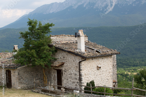 Anticha casa restaurata in un villaggio di montagna abbandonato, al orizzonte Monte Di Canale, Monte Sirente, Abruzzo  photo