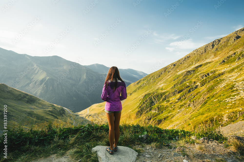Obraz premium Outdoor close up portrait stylish hipster girl behind amazing mountains landscapes,girl in sportswear, sexy model, girl hiking