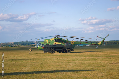 Old Soviet helicopter at blue sky photo