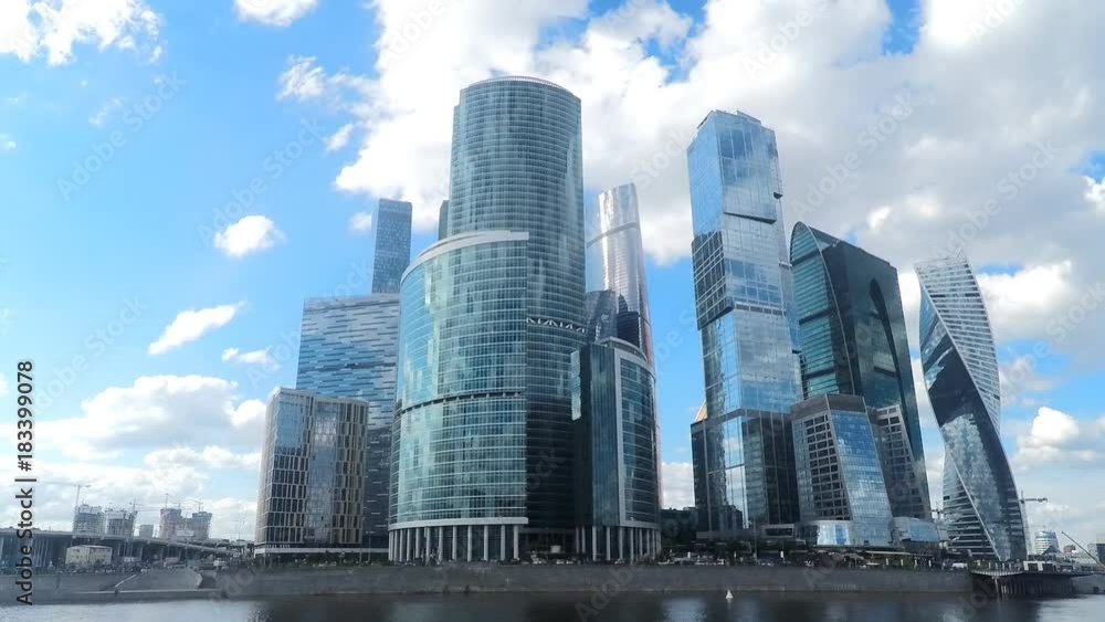 skyscrapers on the river bank in summer timelapse skyscrapers on the river bank in summer timelapse