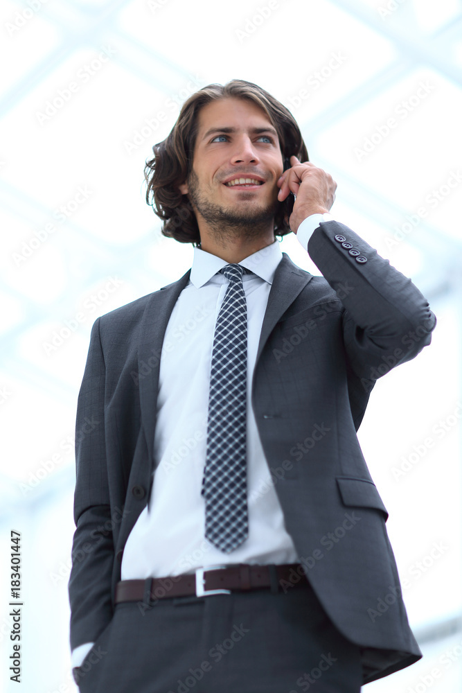businessman talking on mobile .isolated on white. businessman talking on mobile .isolated on white.