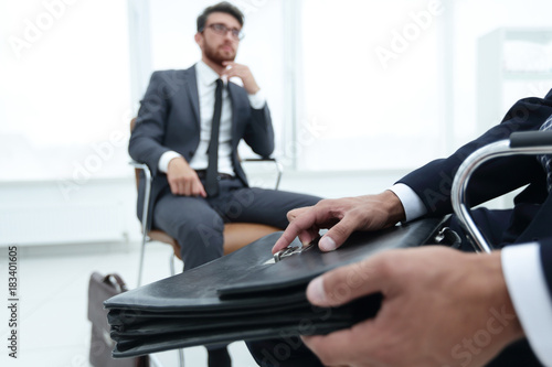 Elegant man in suit with briefcase