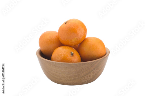 Orange tangerines on a wooden plate on a white background
