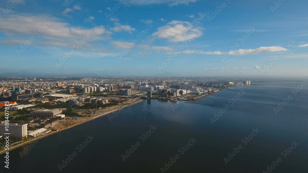 Aerial view skyline of Manila city. Fly over city with skyscrapers and buildings. Aerial skyline of Manila . Modern city by sea, highway, cars, skyscrapers, shopping malls. Aerial footage Makati Aerial view skyline of Manila city. Fly over city with skyscrapers and buildings. Aerial skyline of Manila . Modern city by sea, highway, cars, skyscrapers, shopping malls. Aerial footage Makati
