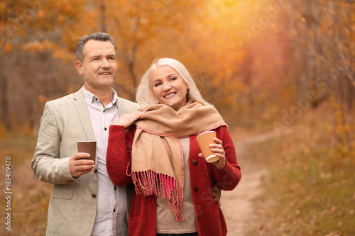 Mature couple walking in pa...