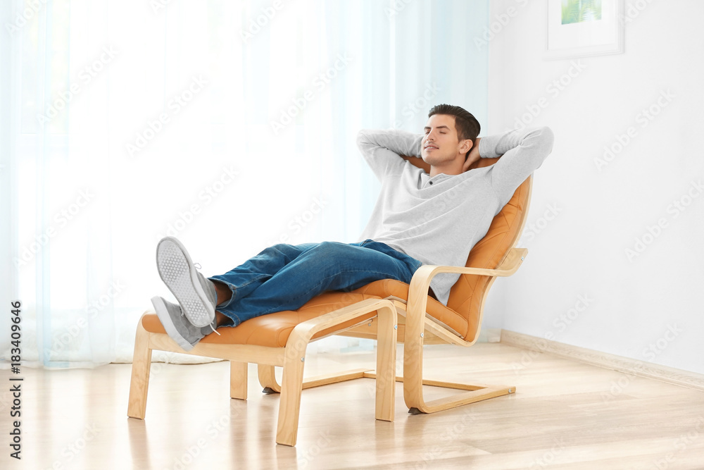 Happy young man relaxing at home Happy young man relaxing at home