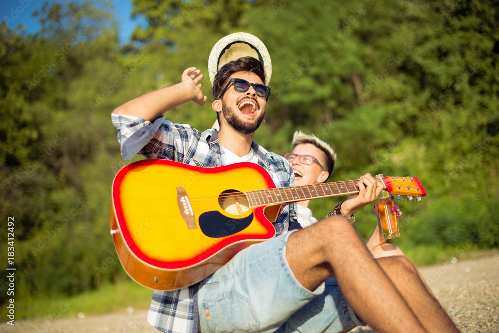 Young hipsters are having a good time on a beach