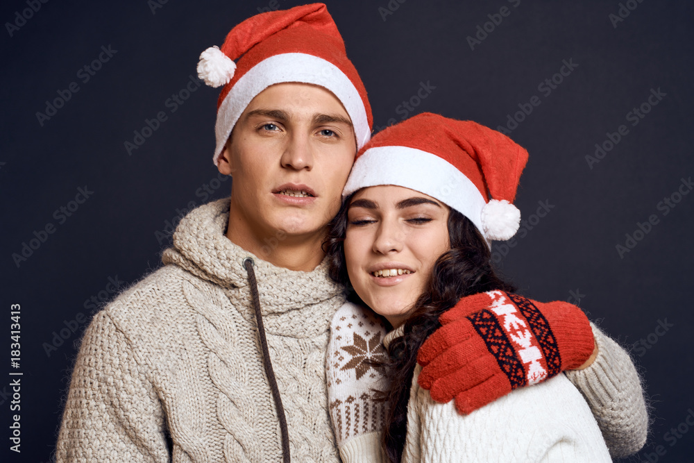 man hugs a woman, a couple, a new year man hugs a woman, a couple, a new year