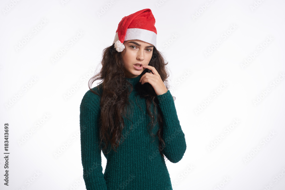 woman in green dress holds a hand near the mouth, christmas, winter, new year woman in green dress holds a hand near the mouth, christmas, winter, new year