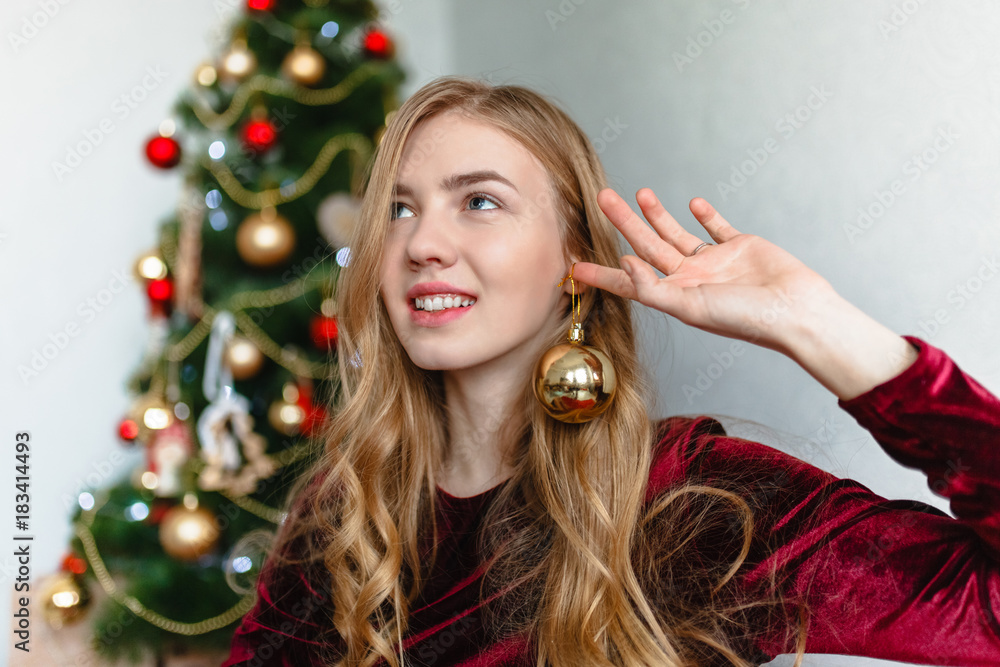 Christmas Woman. Portrait of a girl. Girl smiling. Girl celebrates Christmas Christmas Woman. Portrait of a girl. Girl smiling. Girl celebrates Christmas
