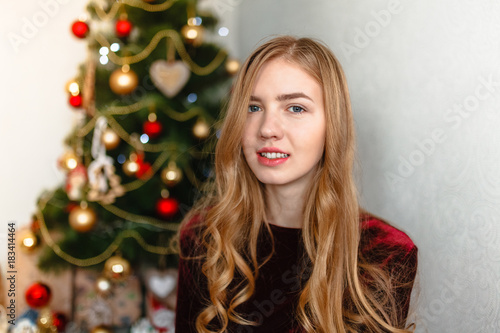 Christmas Woman. Portrait of a girl. Girl smiling. Girl celebrates Christmas