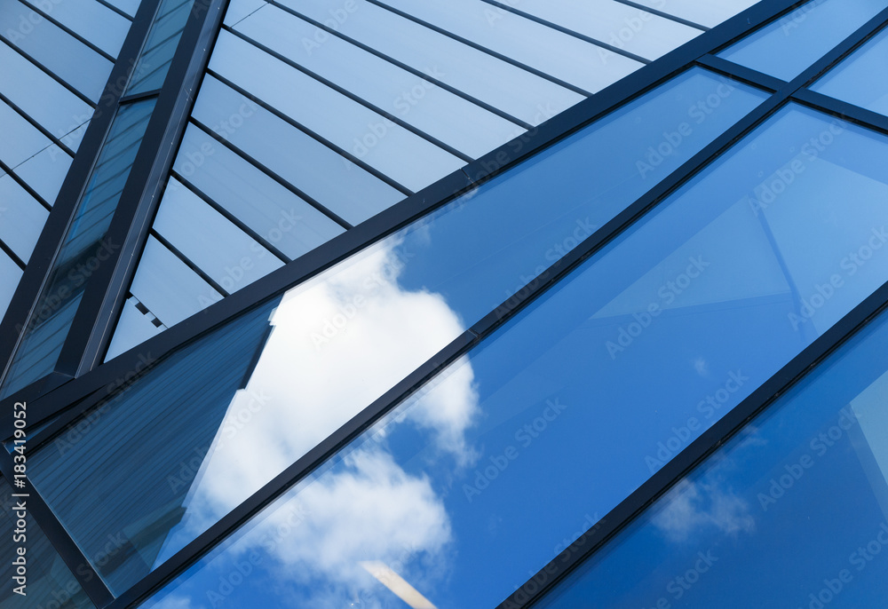 Reflections of sky and clouds in modern building Reflections of sky and clouds in modern building
