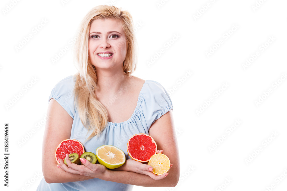 Woman holding fruits kiwi. orange, lemon and grapefruit Woman holding fruits kiwi. orange, lemon and grapefruit