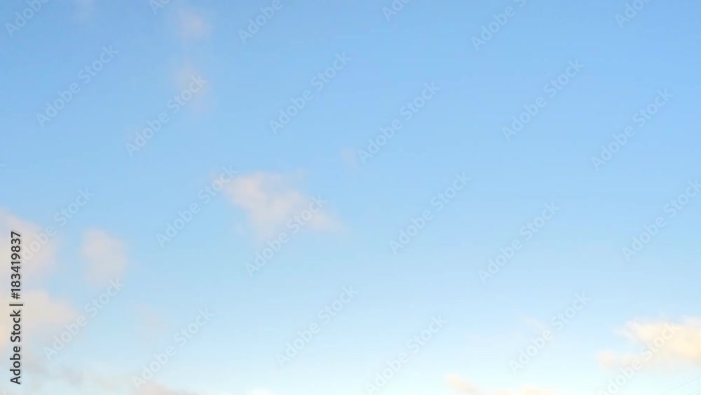 blue sky with floating sunset clouds timelapse blue sky with floating sunset clouds timelapse