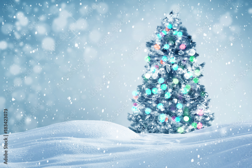 Decorated Christmas tree outdoors, falling snow holiday background