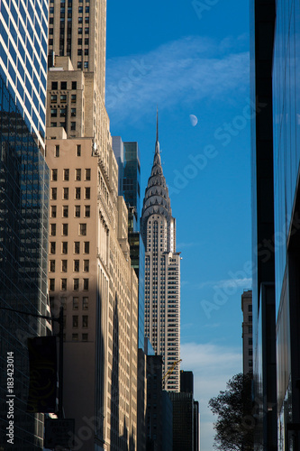 Chrysler Building at daylight with moon in winter afternoon