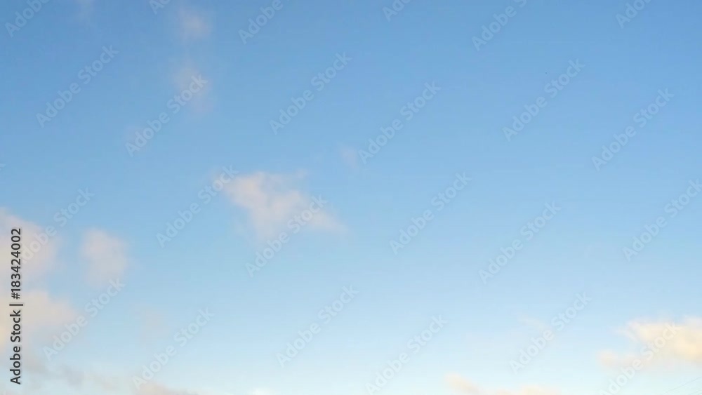 blue sky with many floating sunset clouds timelapse blue sky with many floating sunset clouds timelapse