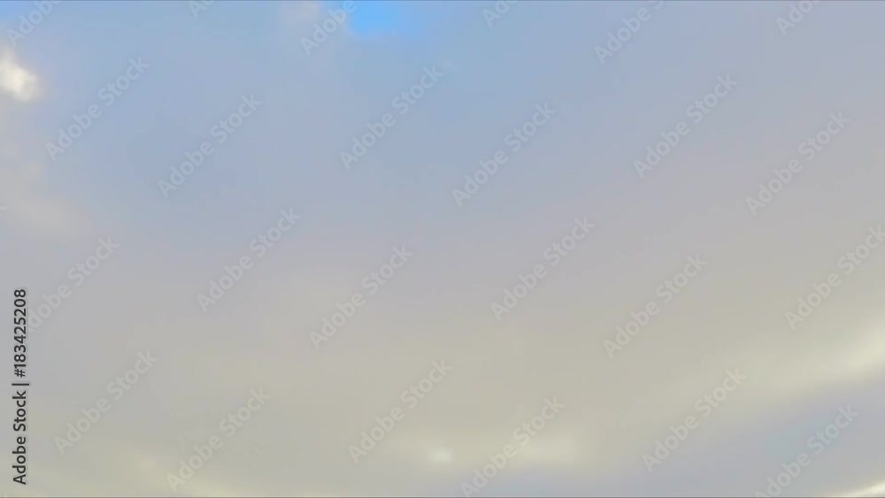 blue sky with floating clouds and sun timelapse blue sky with floating clouds and sun timelapse