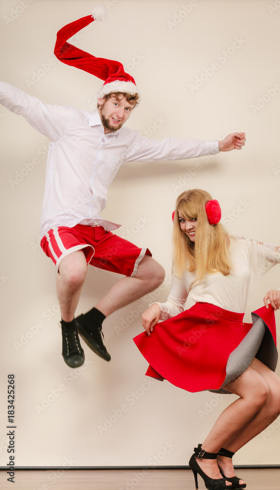 Obraz premium Happy active couple dancing and jumping.