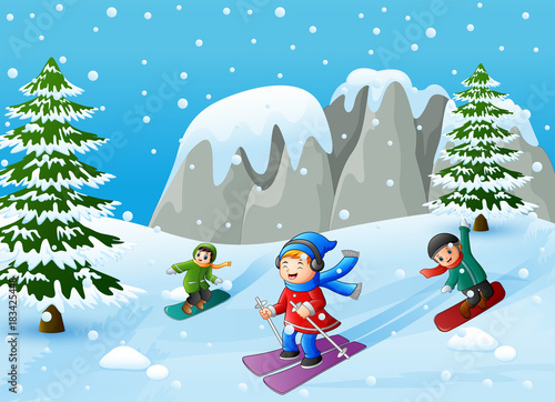 Children playing winter sports in the hill