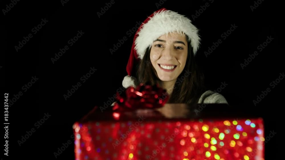Young woman Gives Large Christmas Box (Black Screen) Young woman Gives Large Christmas Box (Black Screen)