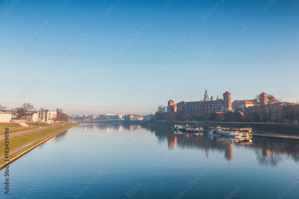 Sunrise over the historic royal Wawel Castle in Cracow, Poland