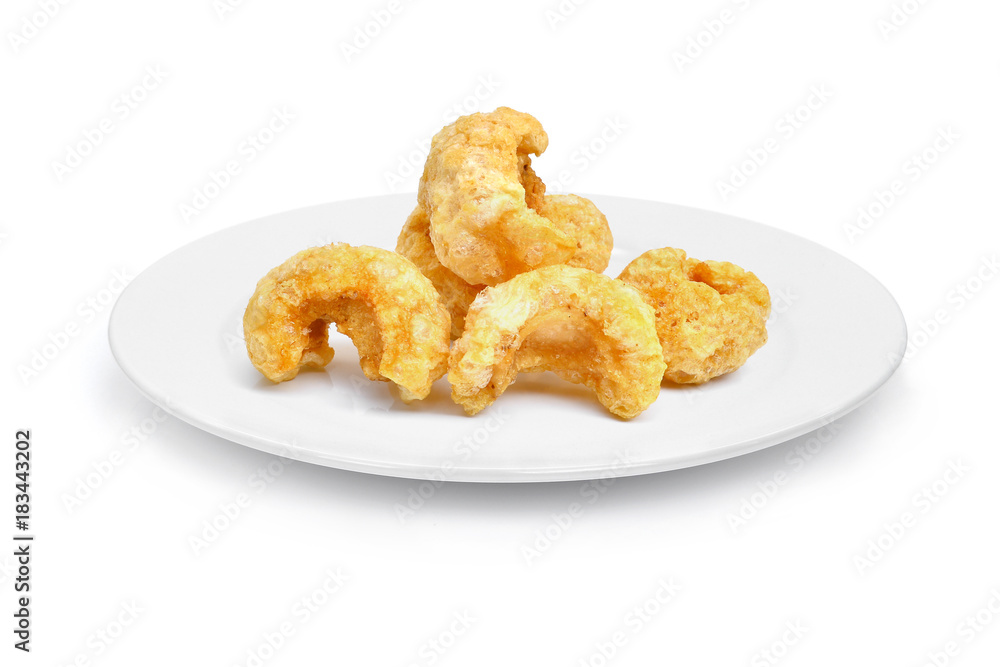 pork snack, pork rind, pork scratching, pork crackling,  Asian food in the white plate isolated on white background