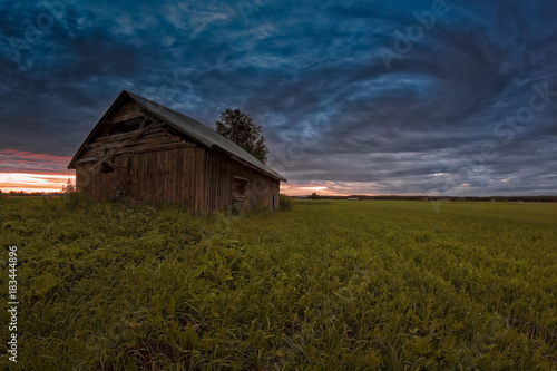 Old Barn House Under The Dramatic Summer Skies