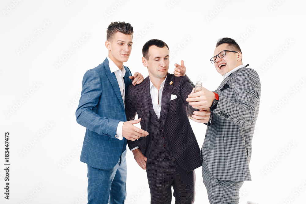 Company of three handsome men having a rest. Isolated background Company of three handsome men having a rest. Isolated background