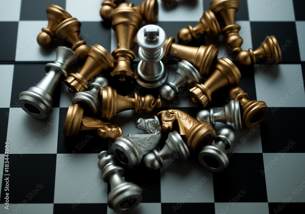SIlver king chess the winner on chess board game.business competition concept. SIlver king chess the winner on chess board game.business competition concept.